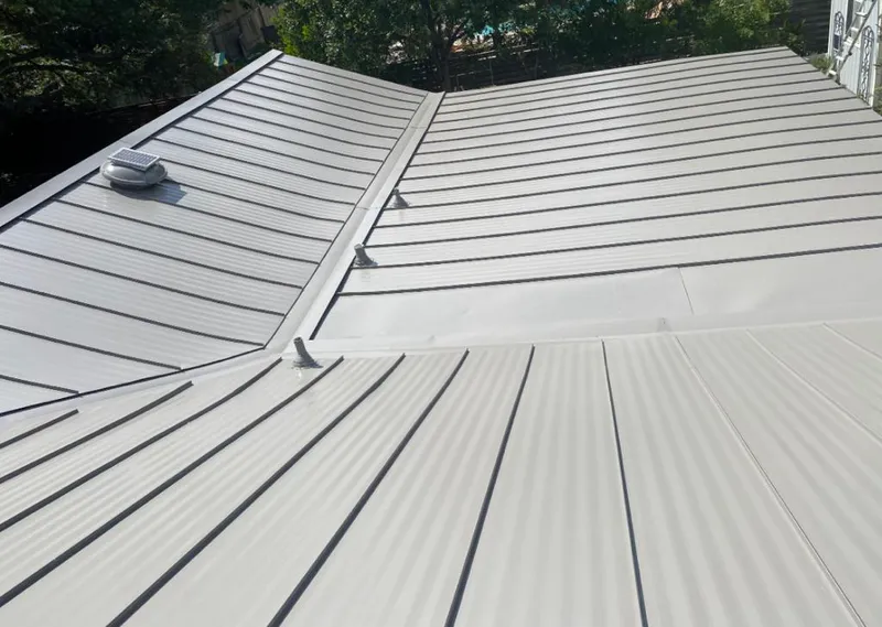Solar attic fan installed on a metal roof for Roof Ventilation in Little Silver